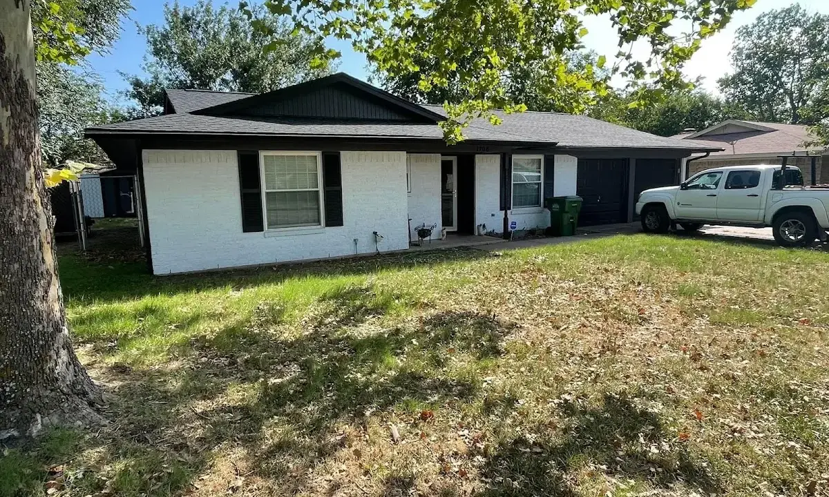 Professional roofing crew working on a residential roof in Beaver Falls
